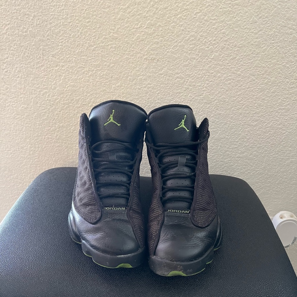 Nike Air Jordan 13’s black and green.